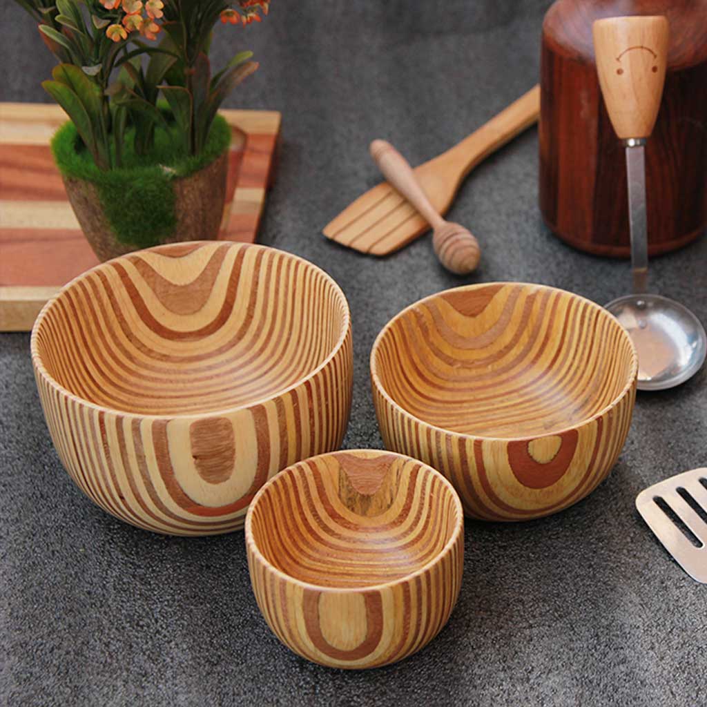 A set of 3 wooden handmade bowls in a patterned plywood style in 3 sizes - large, medium and small.