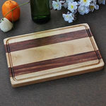 Load image into Gallery viewer, A striped wooden cheese board made with walnut and birch wood.
