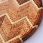 Load image into Gallery viewer, A chevron pattern cheese board or cutting board made from walnut wood and birch wood.
