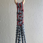 Load image into Gallery viewer, A close up shot of macrame knots on a blue and maroon two-toned macrame plant hanger
