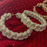 Load image into Gallery viewer, A close up photo featuring the knot details on a white macrame handmade hoop earrings.
