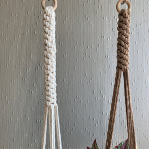 A close up shot of macrame knots on a brown and a white macrame plant hanger