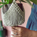 Load image into Gallery viewer, A close up shot of macrame knot detailing on a white macrame plant hanger
