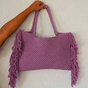 A lavender coloured handcrafted shopper bag with fringe detailing